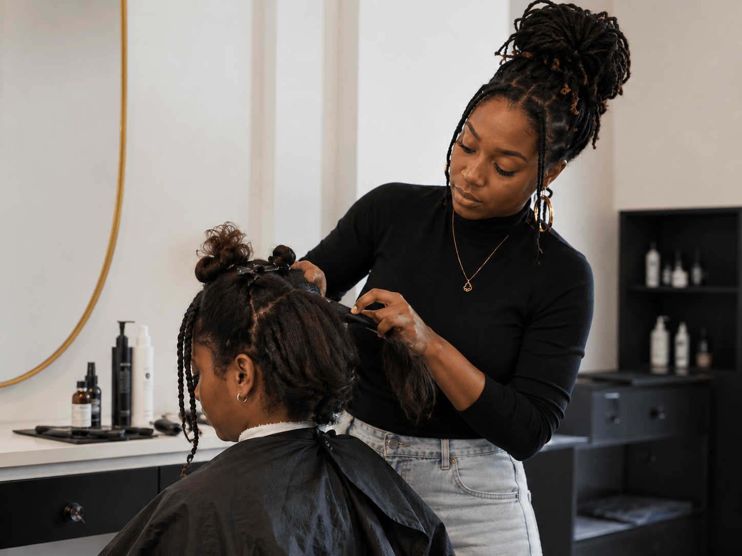 Beauty professional styling a client