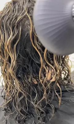 Raw footage: blow-drying curls